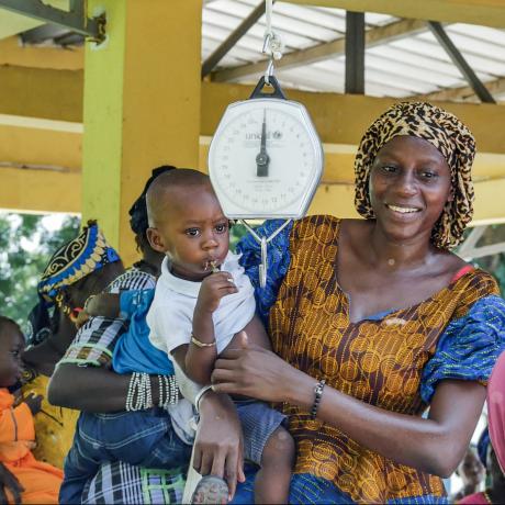 A mother takes her child for immunization