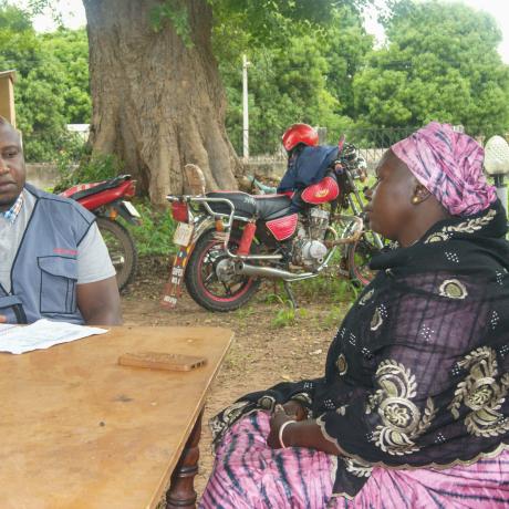 M&E Manager talking to Fatou Manneh, Women's Rep in the District Tribunal 